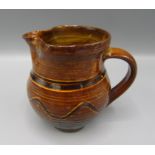 A Pat Groom Winchcombe Pottery jug, 1930s to 1960s, height 9.5cm.