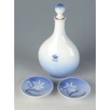 A Royal Copenhagen porcelain decanter and stopper, decorated with Rosenborg Castle No 4378,