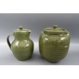 A Crowan green glazed Studio Pottery jar and cover, height 15.5 and a similar jug, height 15cm.