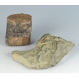 A stone hand axe, length 13.5cm, width 11.5cm, and a fossil fern, height 7.3cm, diameter 6.5cm.