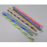 Ten coloured glass swizzle sticks, one filled with pink sand. length 20cm.