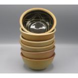 Six Winchcombe Pottery bowls, the interior with tenmoku glaze and wavy incised decoration,