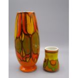 A Poole Pottery vase, the orange ground with a green and yellow abstract design,