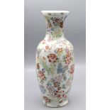 A Chinese porcelain famille rose baluster vase decorated with floral sprays, red seal mark to base,