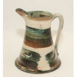 A Jethro Jackson studio pottery jug, painted with birds, signed to the base and dated 06,