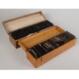 Two boxes of magic lantern slides including children's, Africa related and architectural.