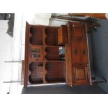 An Arts and Crafts oak dresser with copper mounts and handles,