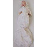A porcelain head doll by Eisenmann and Company, the porcelain head with solid dome,