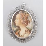 A 20th century miniature in Tudor style silver filigree mounted as a brooch oblique pendant.