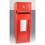 A reproduction V.R. red painted post box, inscribed 'W.T. Allen & Co.