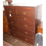 An oak chest of drawers, 19th century, the rectangular moulded top above a mahogany frieze,