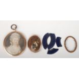 A George III portrait miniature of a lady, her hair beneath a lace cap, gold pendant mount 6 x 4.