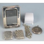 An Edwardian engraved silver vesta case , a silver full hunter case pocketwatch etc.