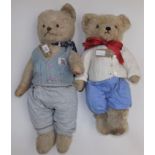 Two pale plush teddy bears, one with worn label to both feet, length 21".