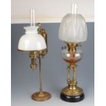 Two Victorian brass oil lamps, height 66 and 62cm.