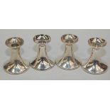 Four modern filled silver low trumpet form candlesticks, height 8.