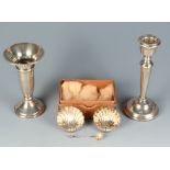 A pair of Edwardian silver shell salt and a slat spoon together with a filled silver spill and