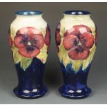 A pair of William Moorcroft 'Pansy' baluster vases,