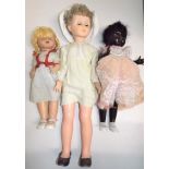 An all composition doll, the head with sleep eyes and painted features, length 21",