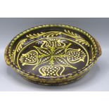 A Paul Young slipware pottery circular shallow dish,