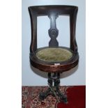 A late 19th century walnut ship's swivel dining chair,