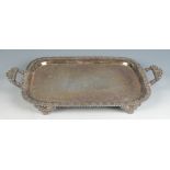 A rectangular tray engraved with flowers about an armorial shield,