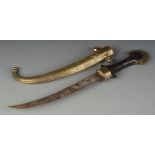 An Islamic dagger, the brass sheath decorated with scrolls and cartouches,