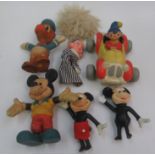 A Bendy toys Noddy in his red and yellow car, a Donald Duck and a similar unmarked Mickey Mouse,