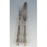 An American carving knife and fork with filled silver Queens pattern handles.