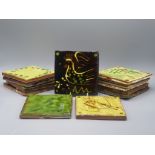 A collection of twelve Clive Bowen Studio Pottery tiles, decorated with fish, a bird,