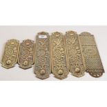 A set of three Victorian flower and leaf cast brass door fingerplates,