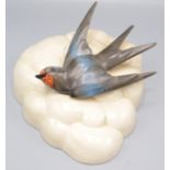 A Clarice Cliff wall pocket, decorated with a swallow, no 874, height 19.5cm.