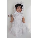 A porcelain head doll, the head with flirty eyes, open mouth and tongue,