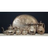 A silver plated five piece tea and coffee service with eagle finials together with an oval gallery