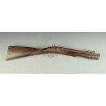 An early 19th century percussion cap blunderbuss with folding bayonet and walnut stock,