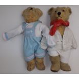 Two golden plush teddy bears, each love worn, length of each 22".