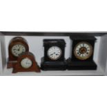 A Victorian black slate mantel clock, height 23cm, width 21.5cm and three other mantel clocks.