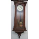 A Victorian oak regulator wall clock, with a single glazed door and 17.