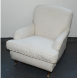 An upholstered Howard pattern armchair, with padded back,