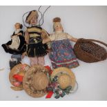A fabric doll with moulded head, one other small plastic doll, bonnets,