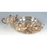 An epns three piece tea service, a tray and four other items.