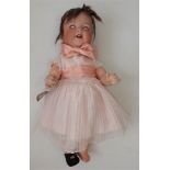 A porcelain head doll by Armand Marseille, the head with sleep eyes, open mouth, teeth and tongue,