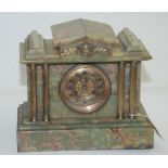 A Victorian green onyx mantel clock, the 9.