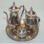A Viners three piece tea service and a circular tray with a pierced gallery.