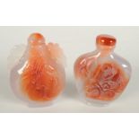 Two Chinese agate snuff bottles, one carved with birds, the other with foliage, one height 6.