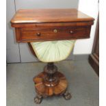 A Victorian rosewood veneered fold top card table of rectangular section with a fitted stationery