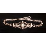 A good belle epoque white gold, yellow gold and silver bracelet set with diamonds and pearls.