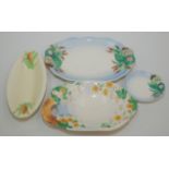 Four miscellaneous Clarice Cliff dishes, largest length 29cm.