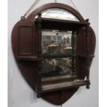 An Edwardian mahogany wall mirror,