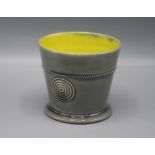 A Walter Keeler Studio Pottery beaker, with a single roundel to the body and yellow glazed interior,